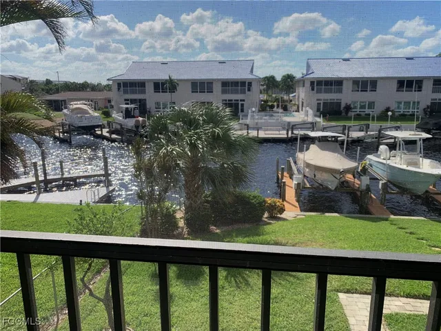 a large body of water with a building in the background