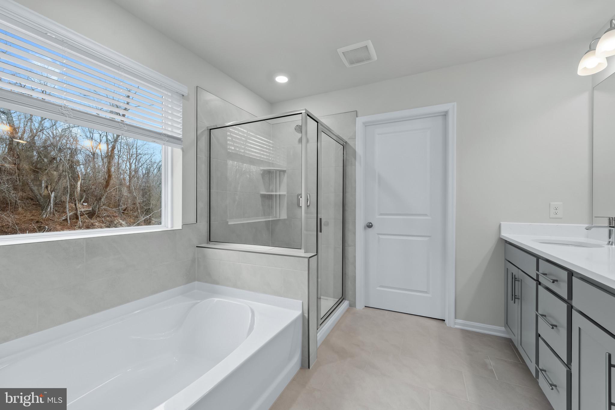 1204 Otter Point Middle River, MD 21220 - Photo 27 of 32 a bathroom with a bathtub and a sink