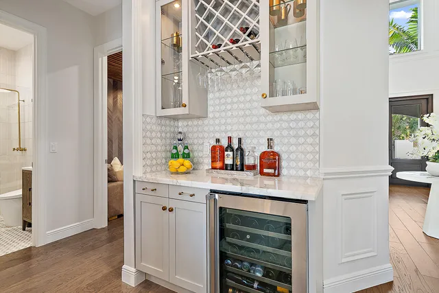 a kitchen with stainless steel appliances granite countertop a refrigerator and a stove