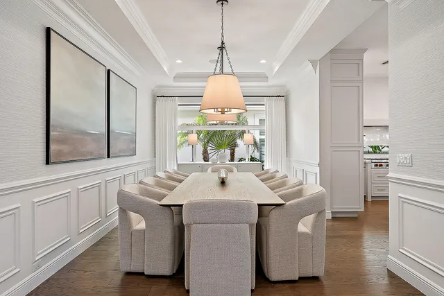 a kitchen with a sink stove and wooden floor