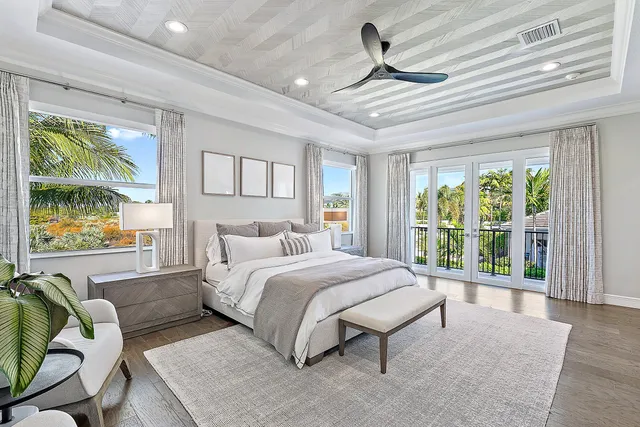 a spacious bathroom with a bathtub sink and mirror