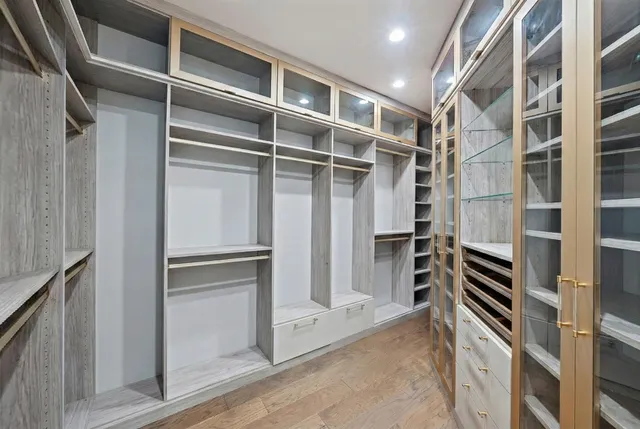 a bathroom with a granite countertop sink toilet a mirror and shower