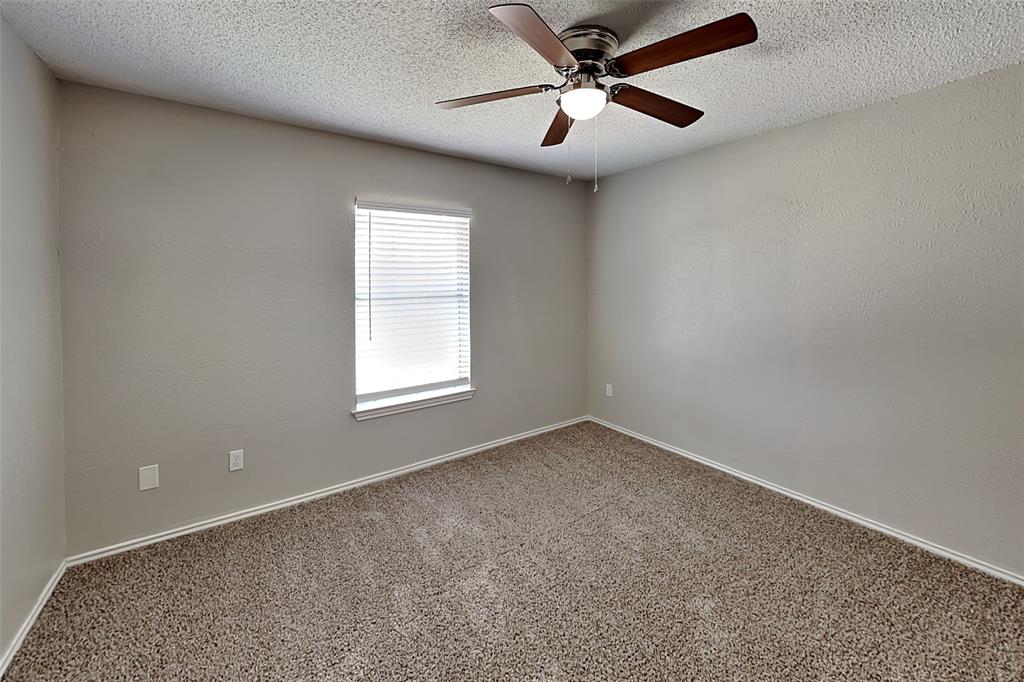 604 Ashby Place Allen, TX 75002 - Photo 15 of 21 an empty room with a window and a fan
