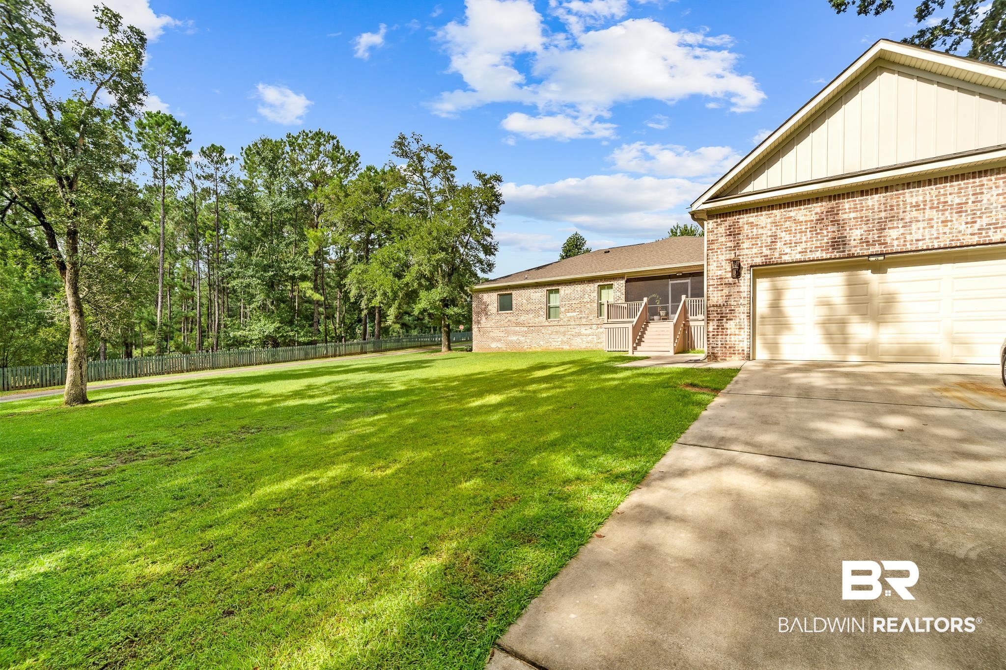 29530 St John Street Daphne, AL 36526 - Photo 36 of 38 View of yard with a garage