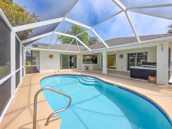 a view of a house with swimming pool