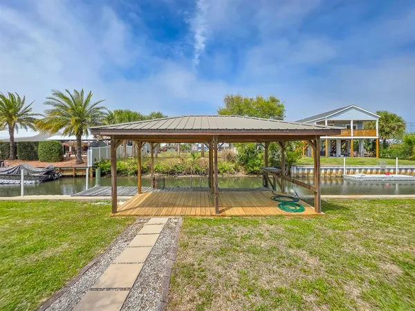 a view of swimming pool with outdoor seating and yard