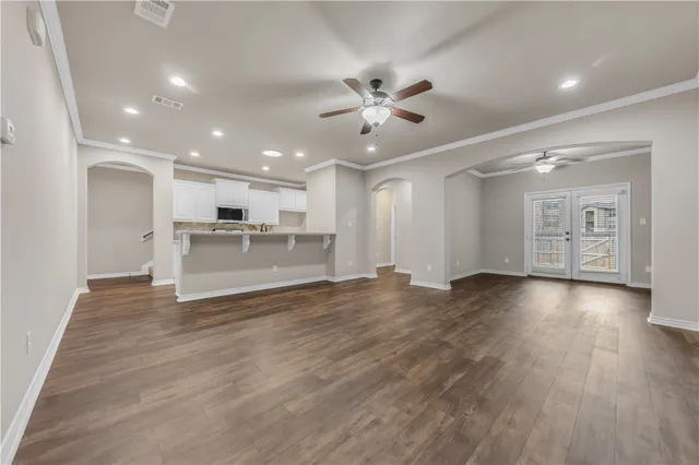 a view of a kitchen with a sink and a stove top oven