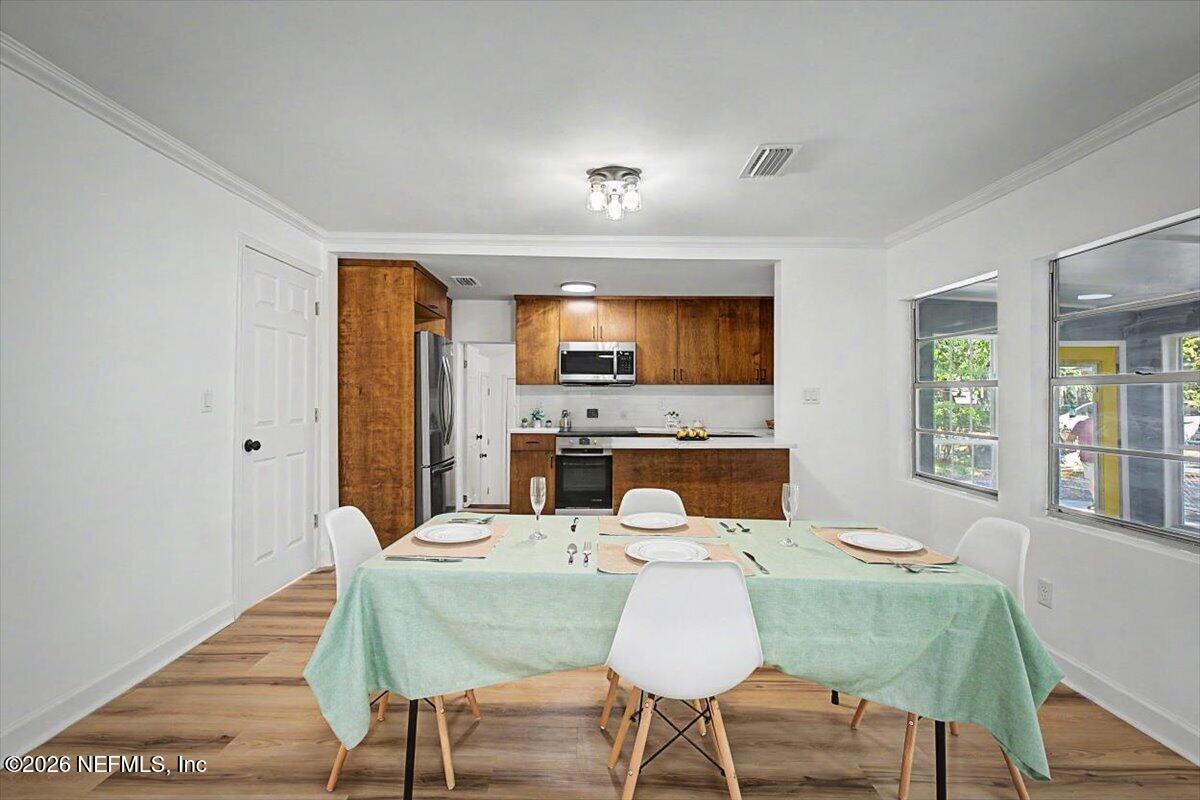 2520 Larsen Road Jacksonville, FL 32207 - Photo 11 of 27 a view of a dining room with furniture and window