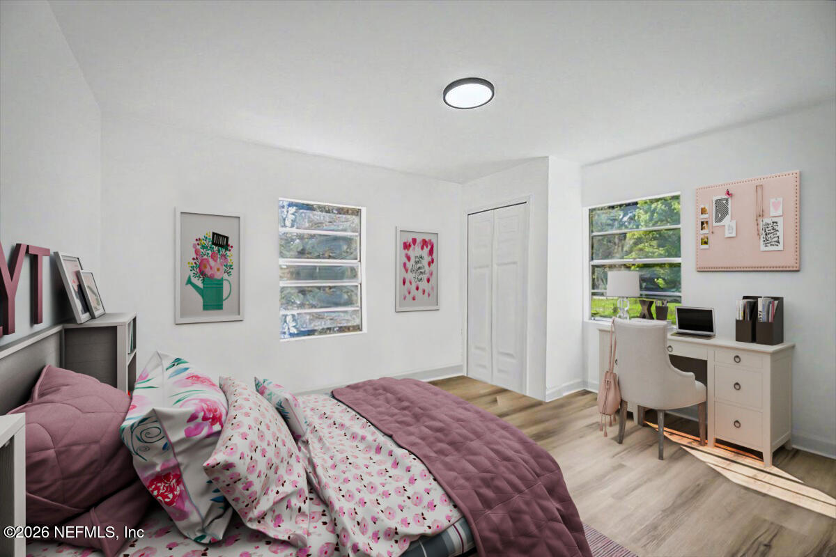 2520 Larsen Road Jacksonville, FL 32207 - Photo 17 of 27 a bedroom with a bed and a window