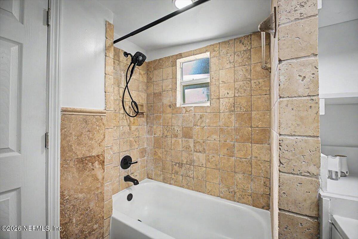 2520 Larsen Road Jacksonville, FL 32207 - Photo 19 of 27 a bathroom with a bathtub and shower