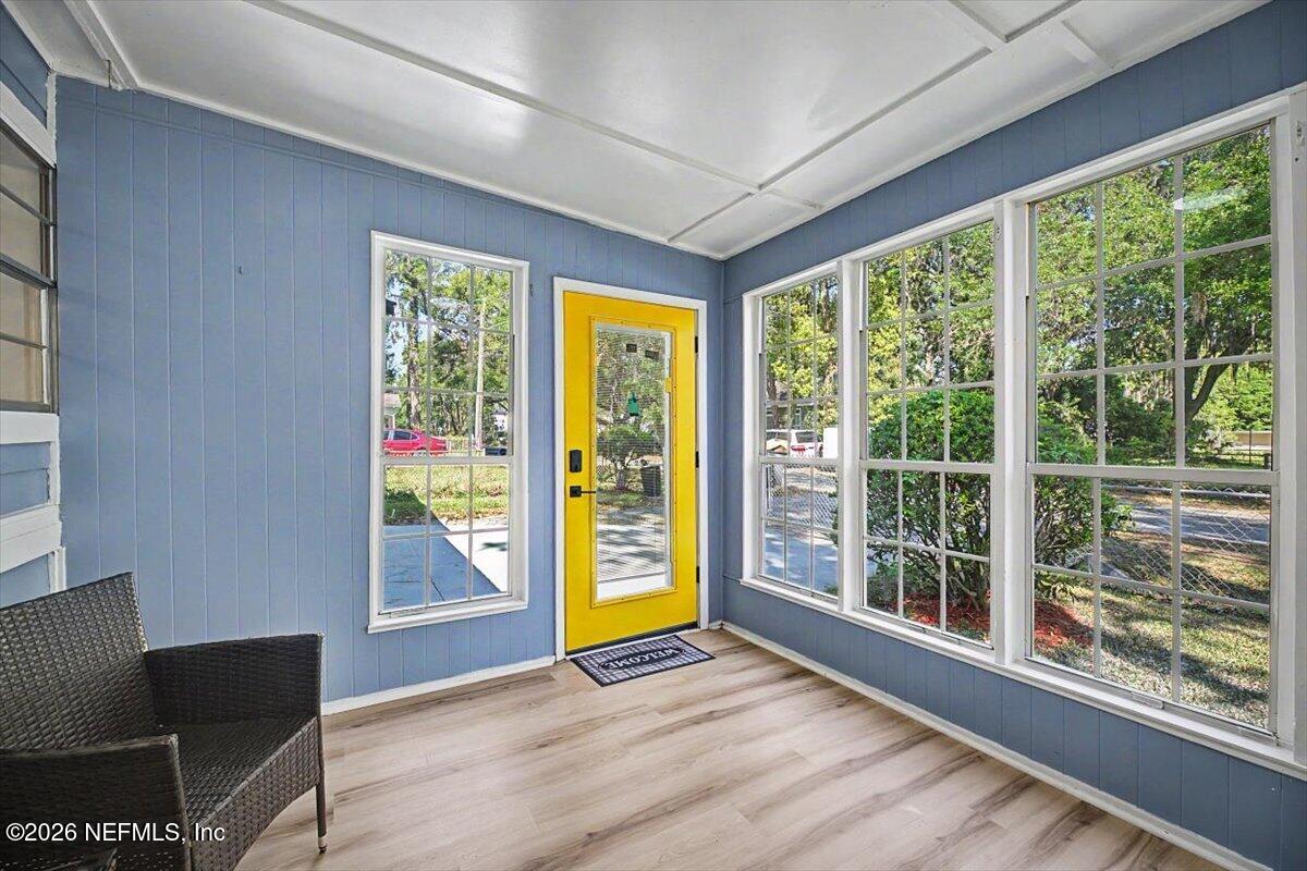 2520 Larsen Road Jacksonville, FL 32207 - Photo 5 of 27 a view of an empty room with wooden floor and a window