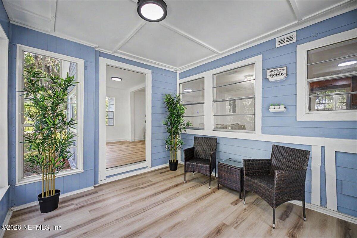 2520 Larsen Road Jacksonville, FL 32207 - Photo 6 of 27 a workspace with furniture window and wooden floor