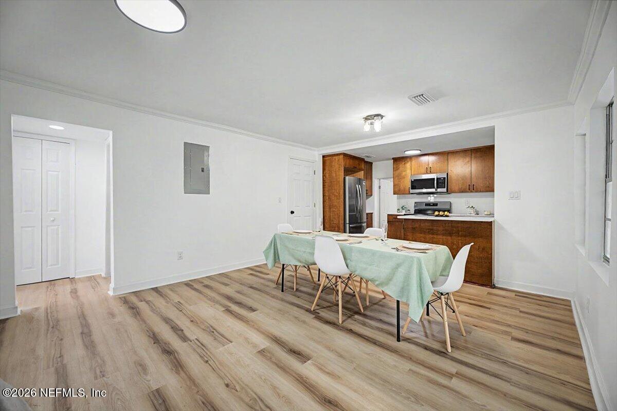 2520 Larsen Road Jacksonville, FL 32207 - Photo 8 of 27 a view of a dining room with furniture and wooden floor