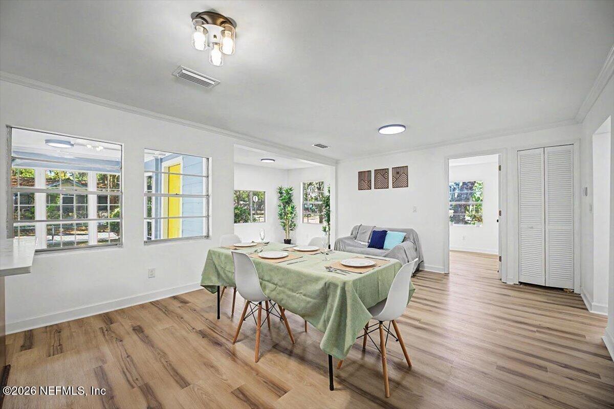 2520 Larsen Road Jacksonville, FL 32207 - Photo 10 of 27 a view of a dining room with furniture window and wooden floor