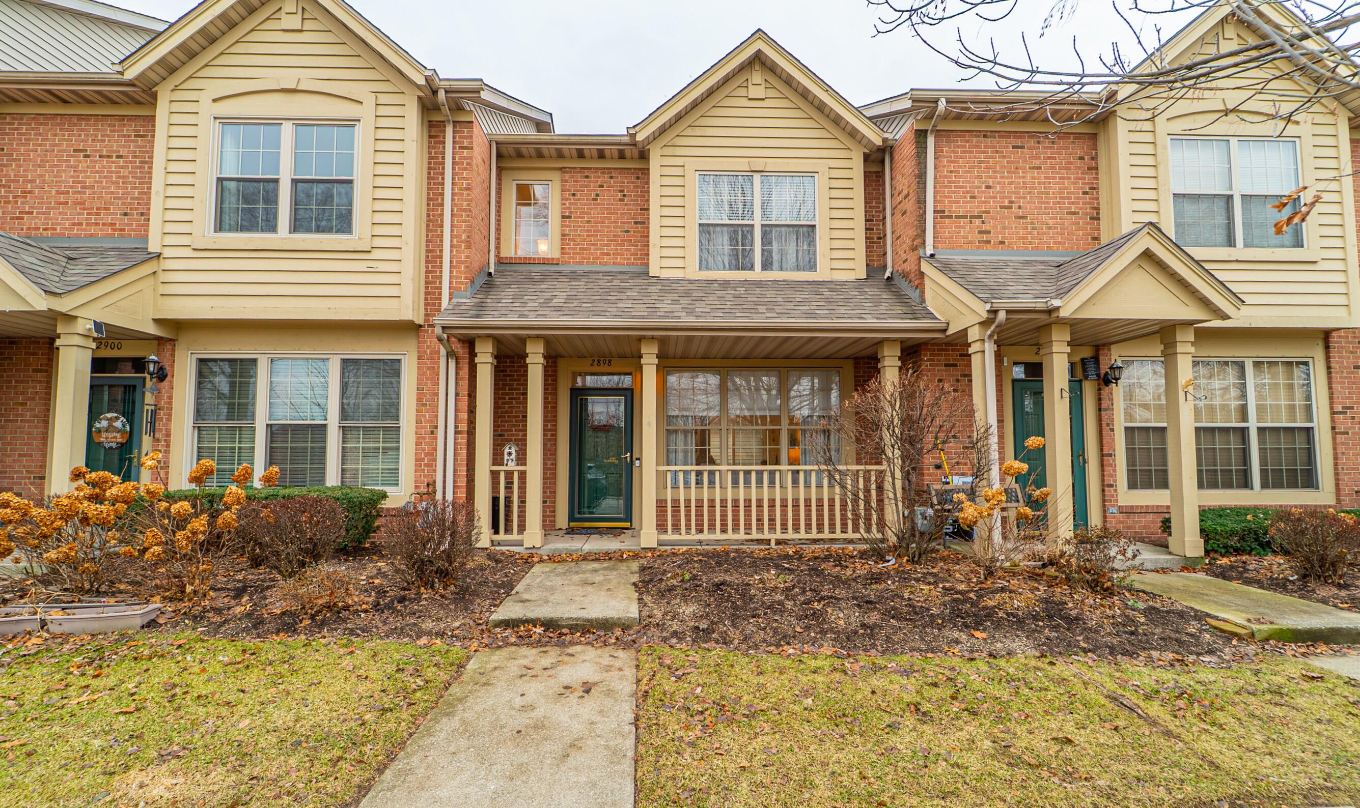 2898 Cambridge Way Highland, IN 46322 - Photo 1 of 22 a front view of a house with a garden
