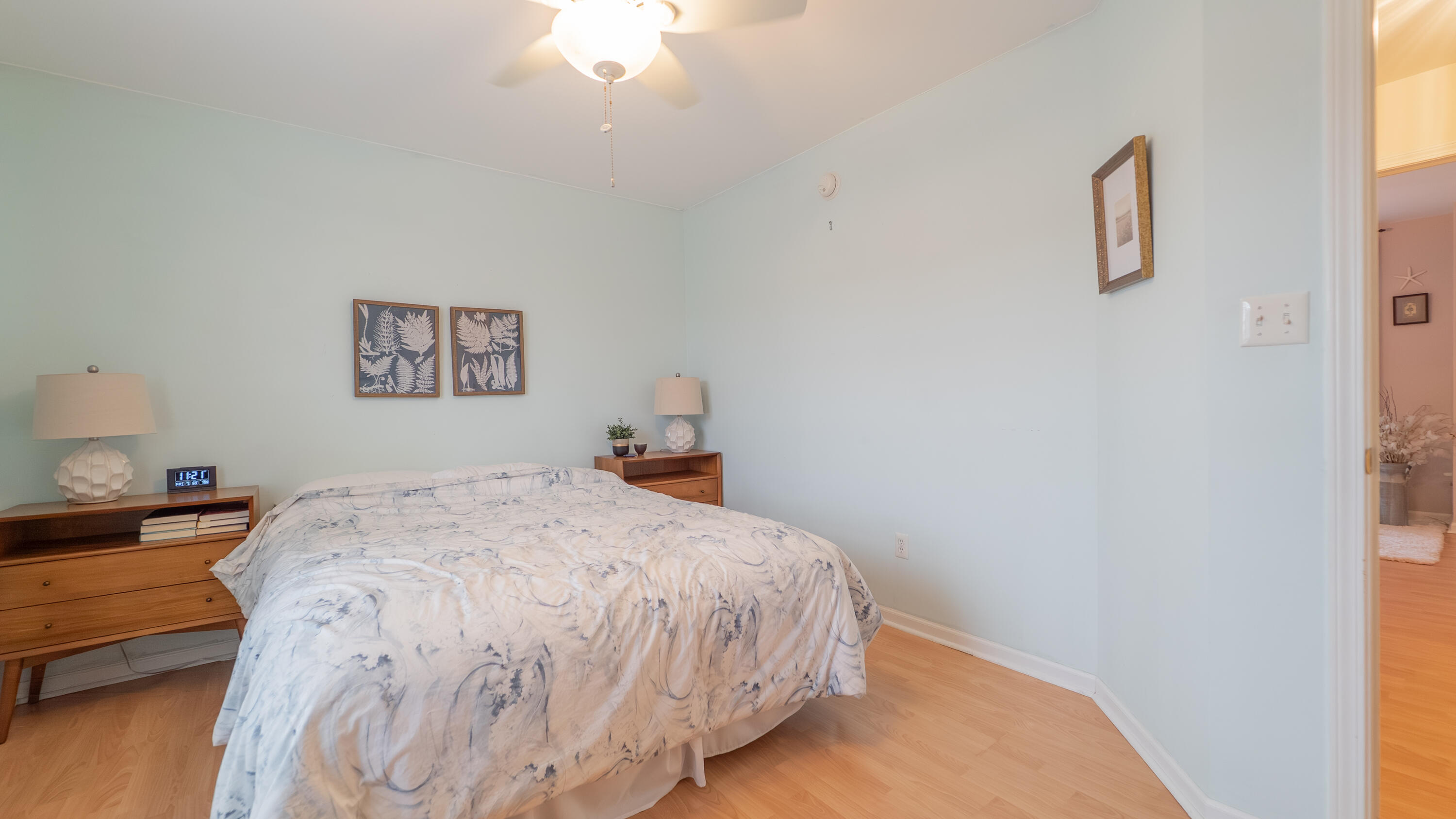 2898 Cambridge Way Highland, IN 46322 - Photo 16 of 22 a bedroom with a bed and a chandelier