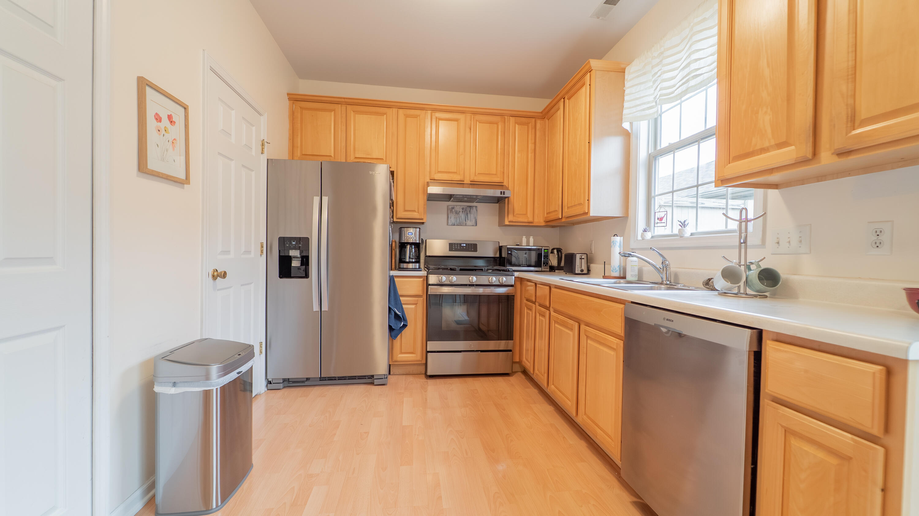 2898 Cambridge Way Highland, IN 46322 - Photo 7 of 22 a kitchen with stainless steel appliances a refrigerator sink and cabinets