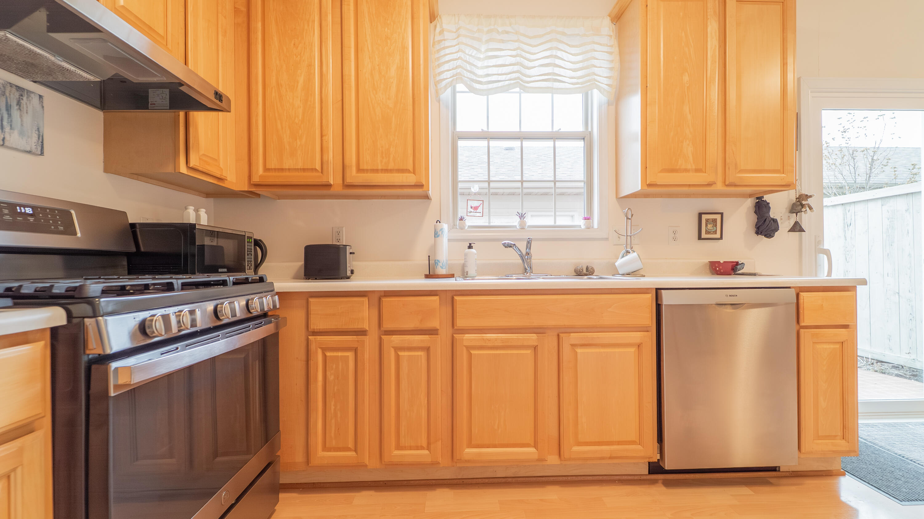 2898 Cambridge Way Highland, IN 46322 - Photo 10 of 22 a kitchen with stainless steel appliances granite countertop a stove a sink and white cabinets