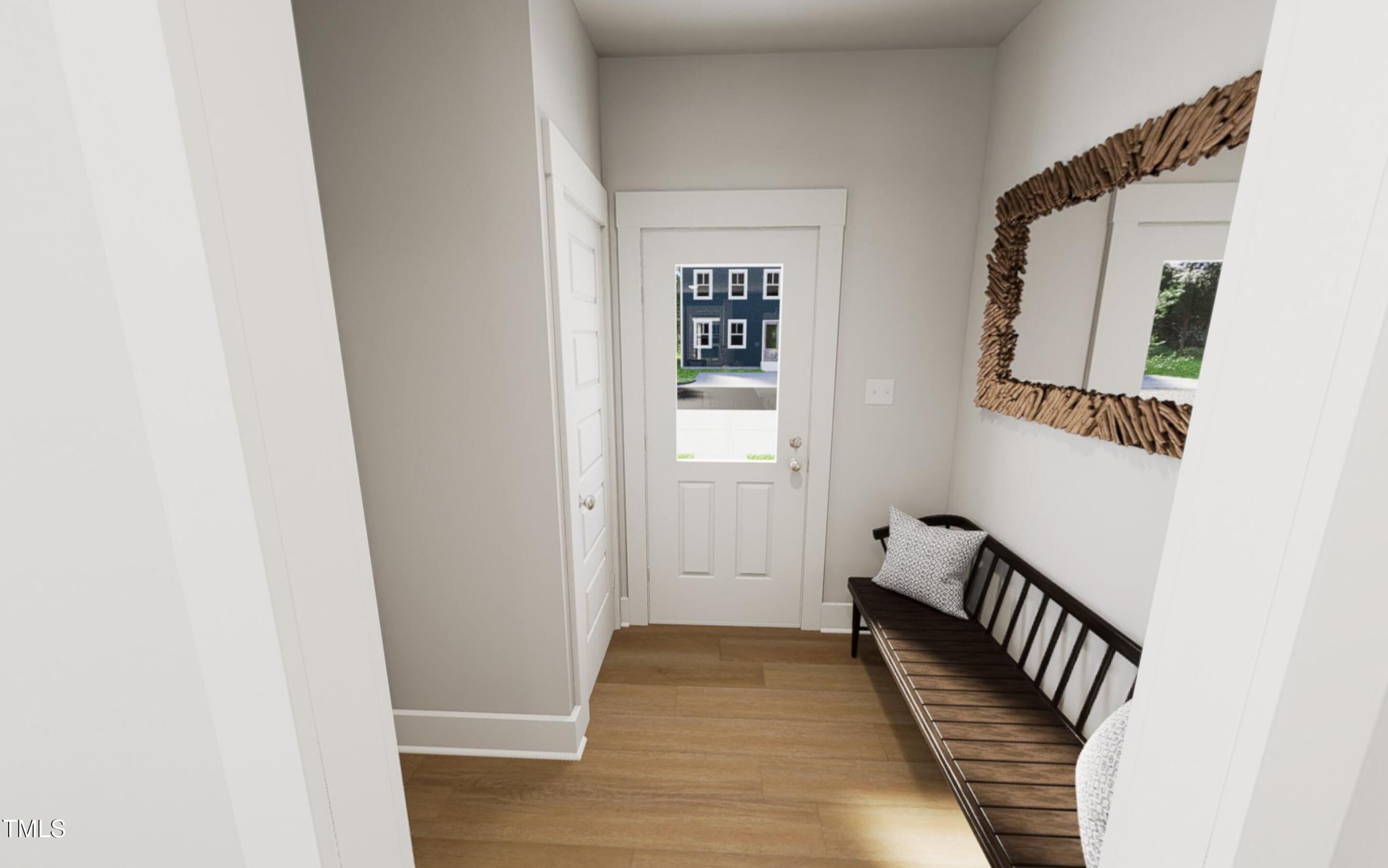 344 Cottage Hl Way Raleigh, NC 27604 - Photo 4 of 33 a view of a hallway with wooden floor and staircase