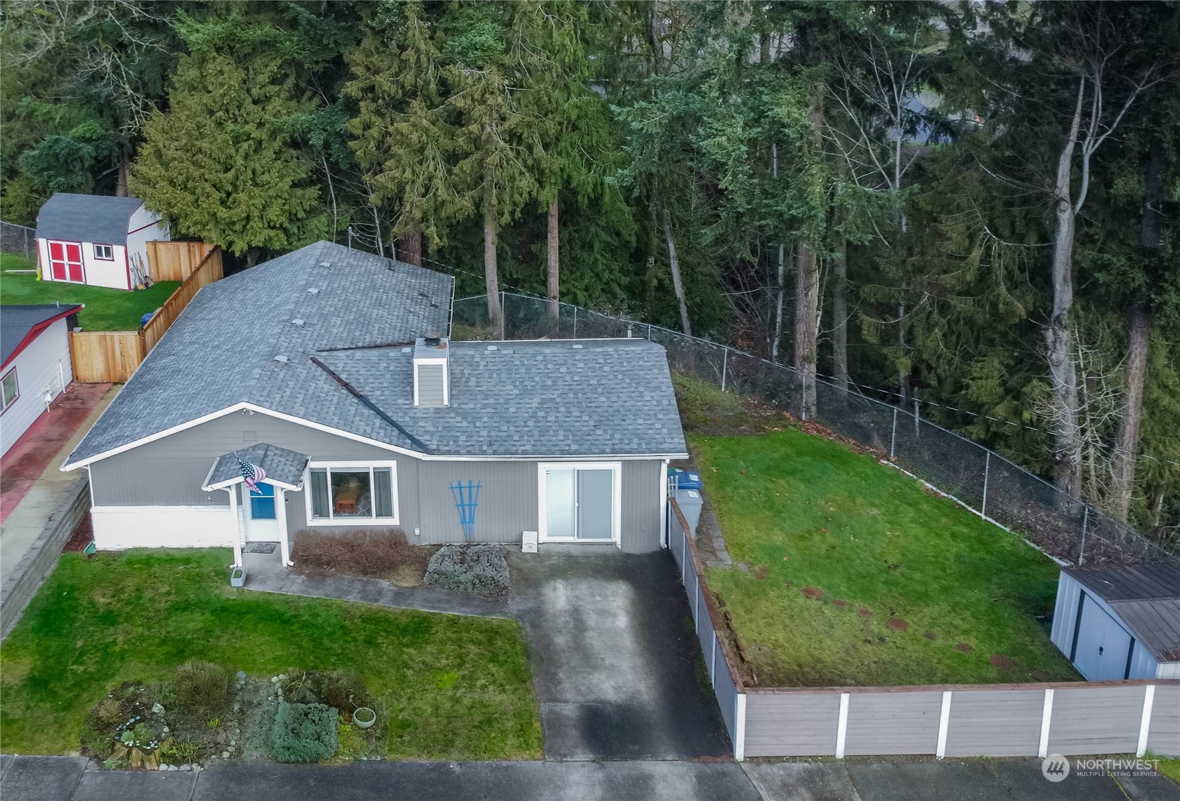 4512 Southeast 2nd Place Renton, WA 98059 - Photo 36 of 39 a aerial view of a house next to a big yard and large trees