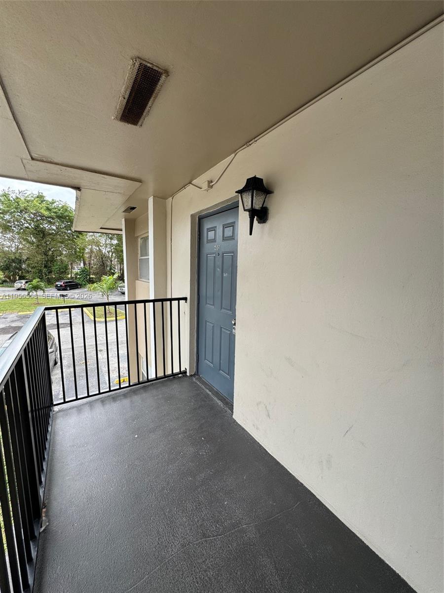 8060 Fairview Drive, Unit 201 Tamarac, FL 33321 - Photo 24 of 33 a view of a hallway with a window
