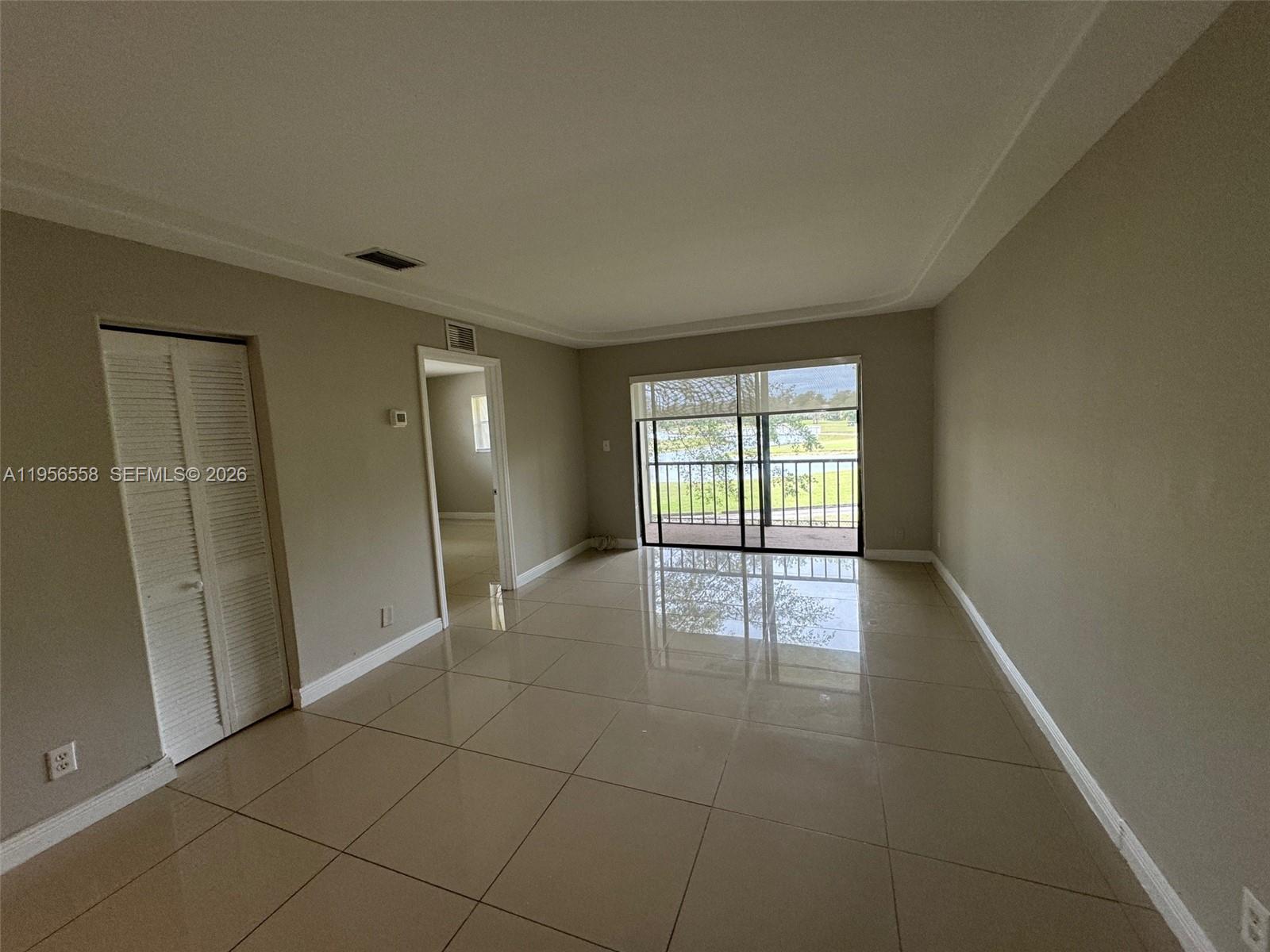 8060 Fairview Drive, Unit 201 Tamarac, FL 33321 - Photo 9 of 33 a view of an empty room and window