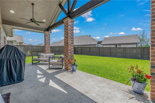 a view of a garden with sitting area