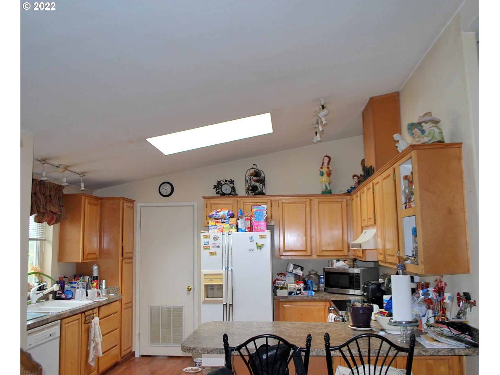 29210 Old Rainier Road Rainier, OR 97048 - Photo 16 of 32 a view of a kitchen with dining table and chairs