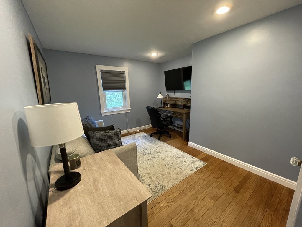 17 Audrea Road Framingham, MA 01701 - Photo 15 of 27 a living room with furniture and a flat screen tv