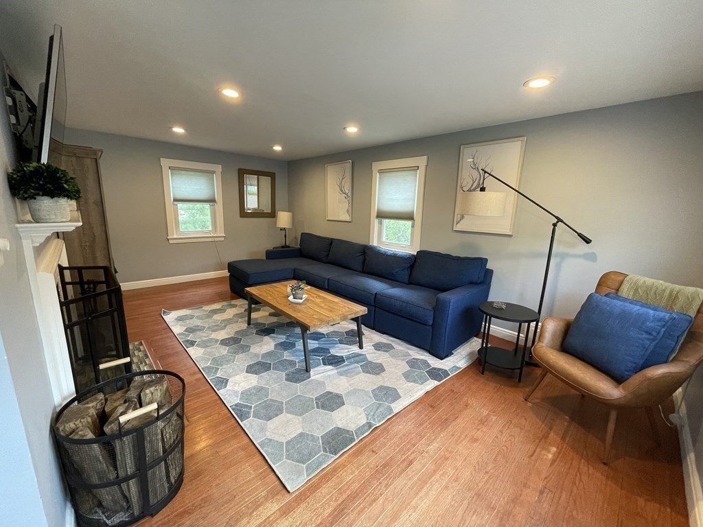 17 Audrea Road Framingham, MA 01701 - Photo 3 of 27 a living room with furniture and a flat screen tv