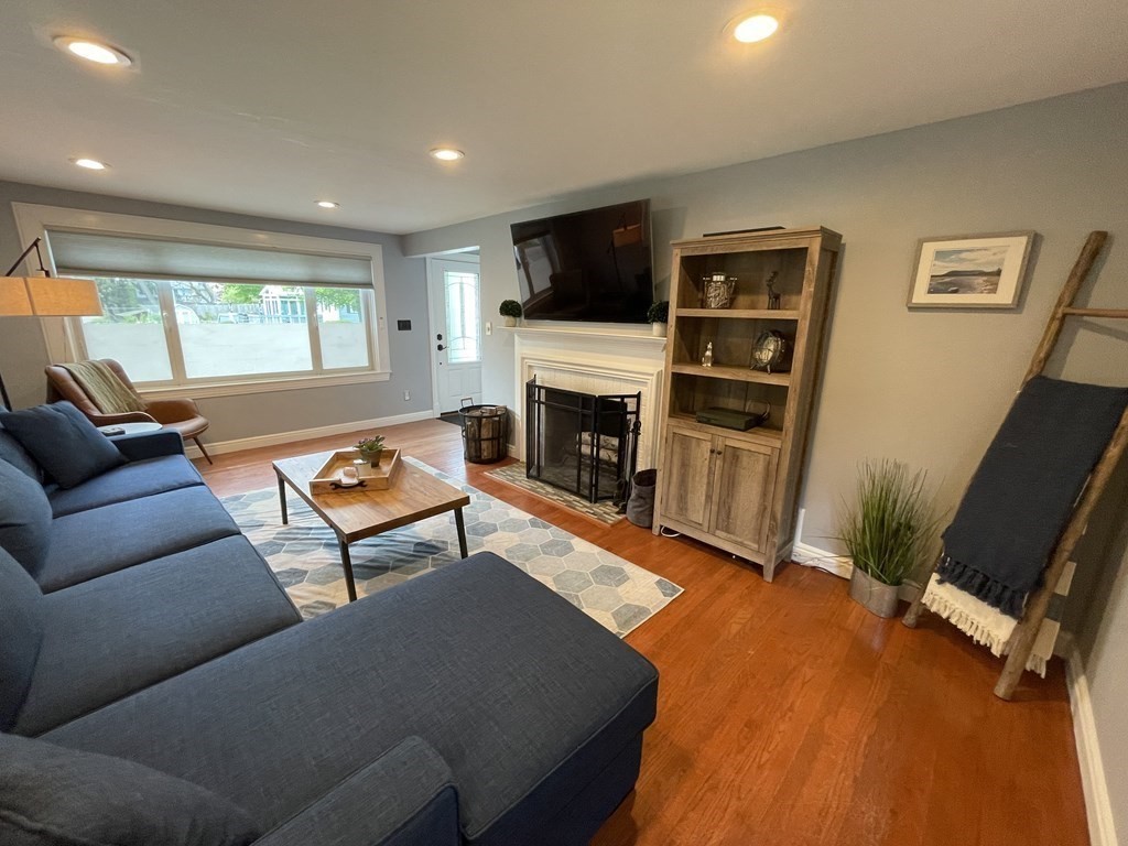 17 Audrea Road Framingham, MA 01701 - Photo 5 of 27 a living room with furniture and a flat screen tv