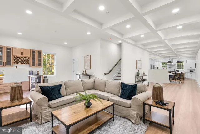 a view of a a dining room with furniture window and wooden floor