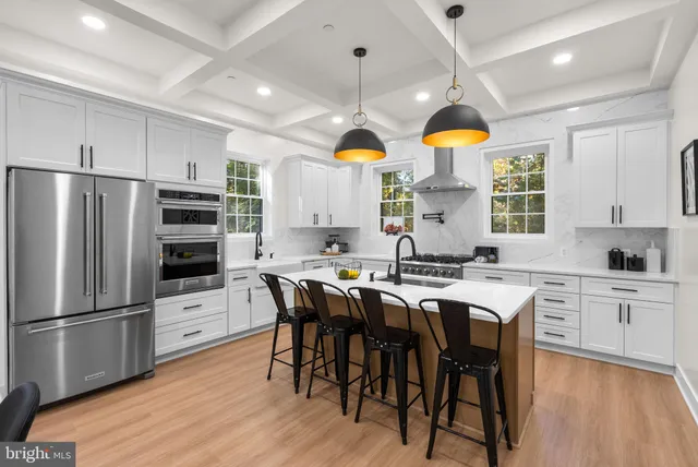 a kitchen that has a table and chairs in it