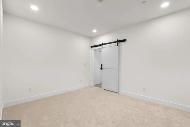 a living room with furniture and windows