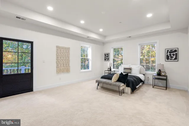 a bathroom with a shower and a glass door