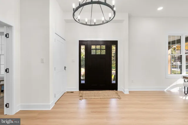 a view of a workspace with furniture and window
