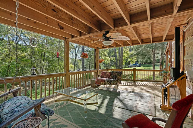 a view of a chairs and table in patio