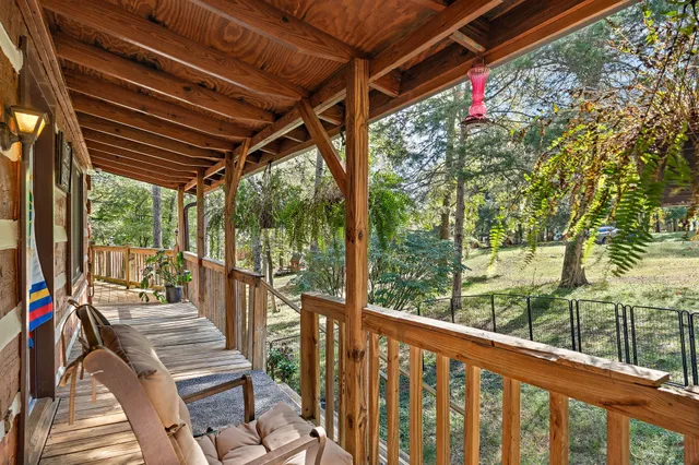 a view of a two chairs in the balcony