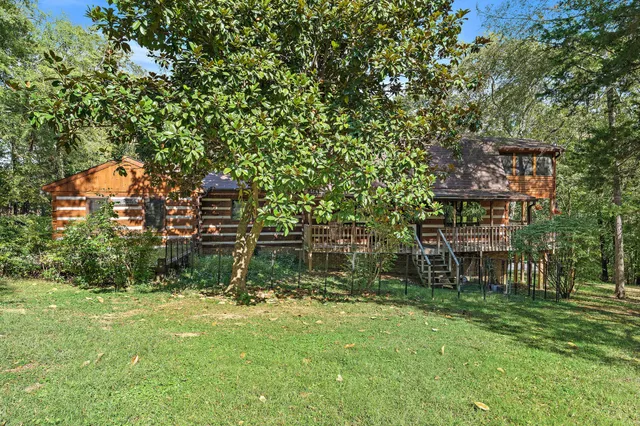 a backyard of a house with lots of green space