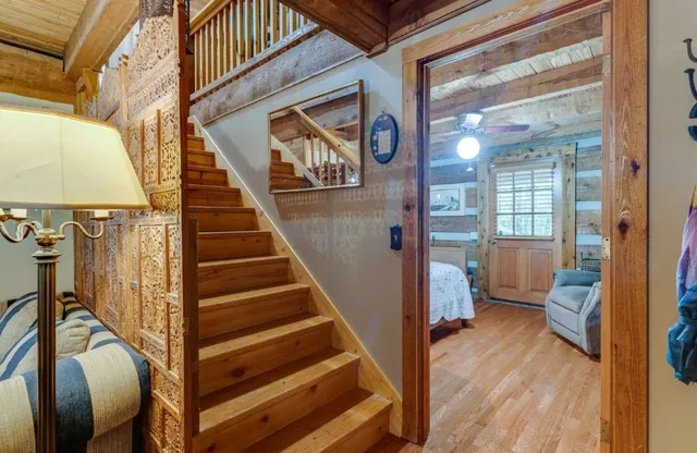 a view of an entryway with wooden floor and door