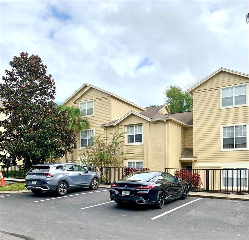 413 Summit Ridge Place, Unit 209 Longwood, FL 32779 - Photo 1 of 1 a car parked in front of a house