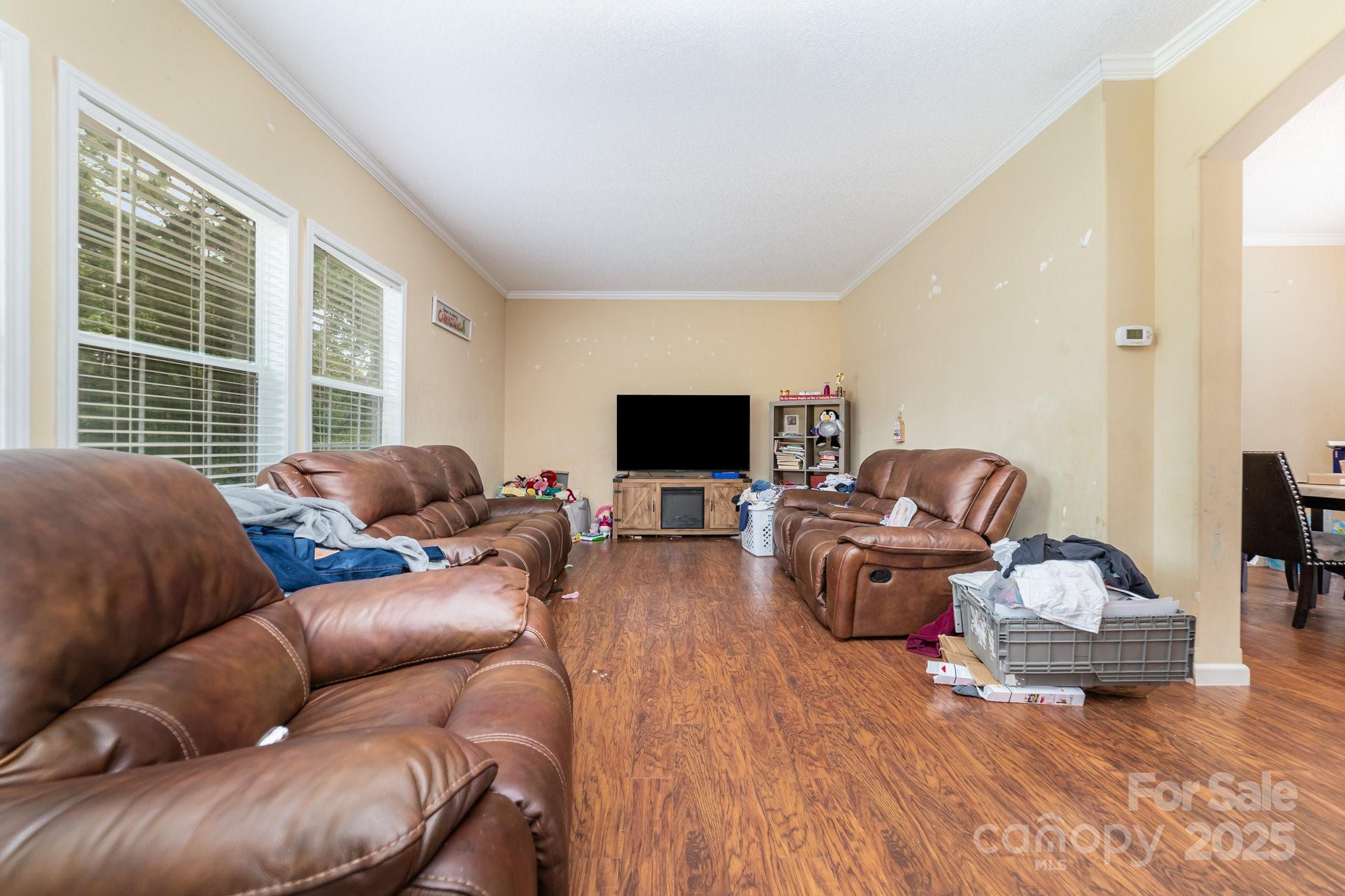 1206 Old Friendship Road Rock Hill, SC 29730 - Photo 2 of 8 a living room with furniture a flat screen tv and a large window