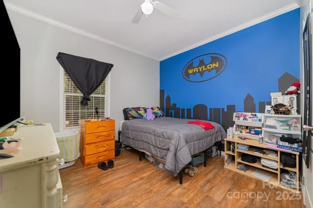 a bedroom with a bed and a table in it