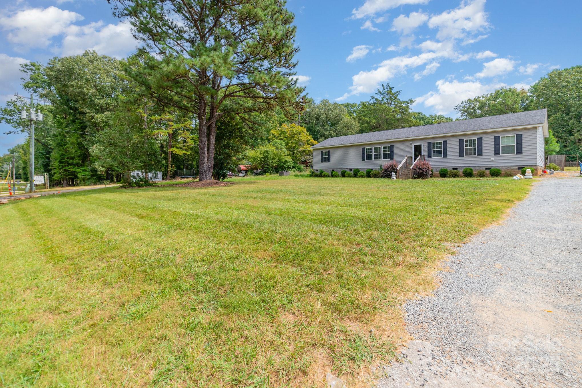 1206 Old Friendship Road Rock Hill, SC 29730 - Photo 8 of 8 a front view of a house with a garden