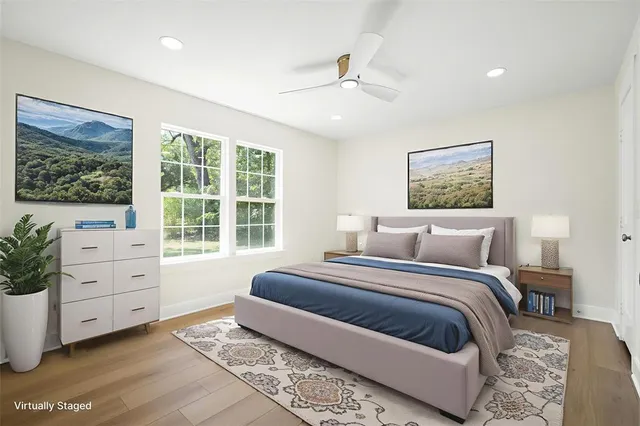 a bedroom with a large bed and a window