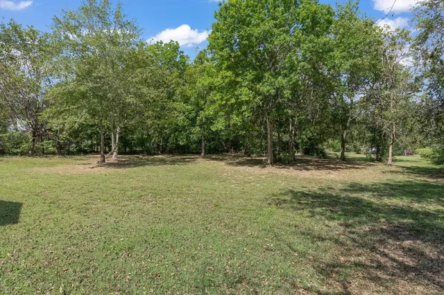 a backyard of a house with lots of green space