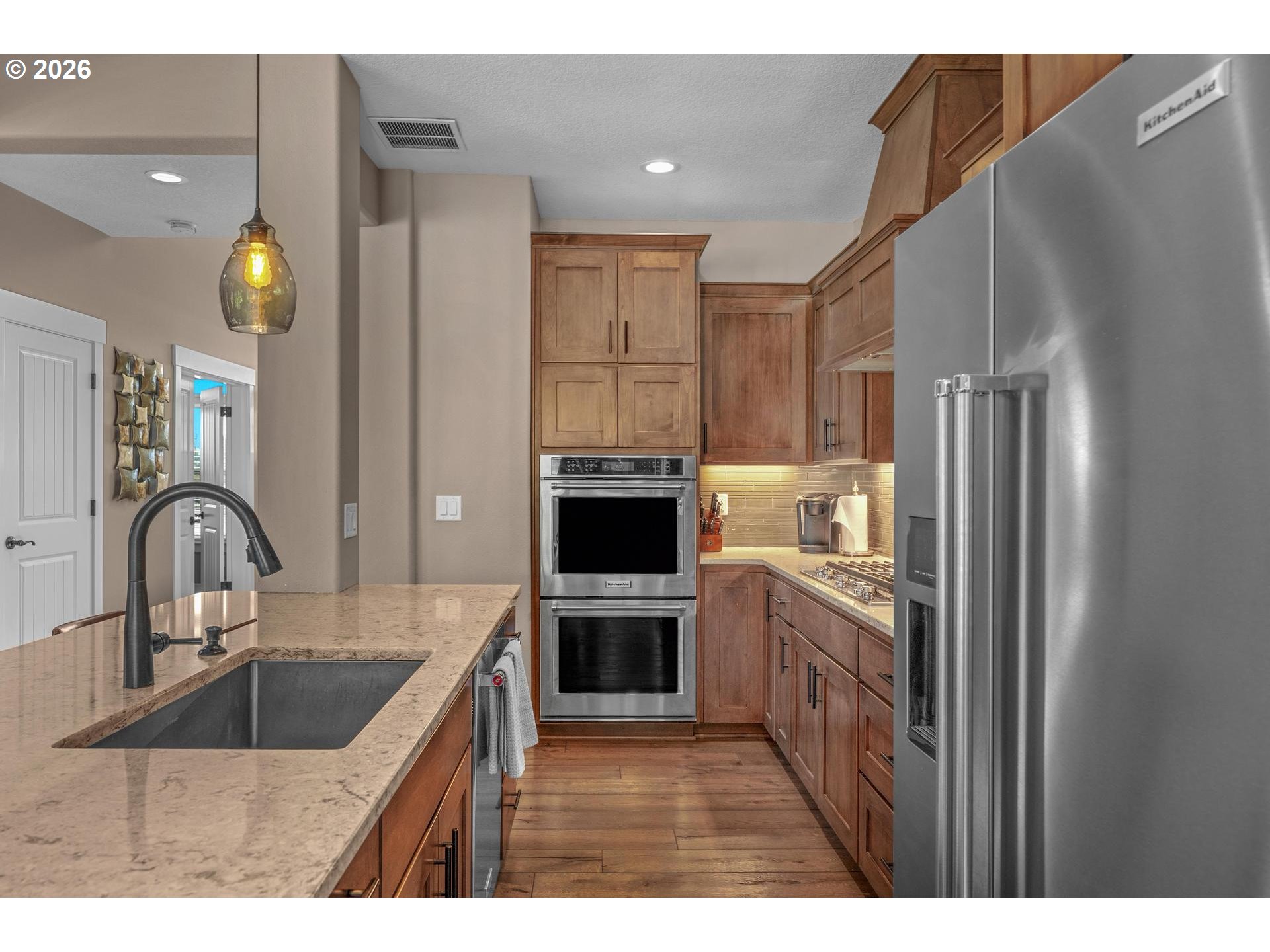 34281 Millard Road Warren, OR 97053 - Photo 13 of 47 a kitchen with kitchen island a sink stainless steel appliances and cabinets
