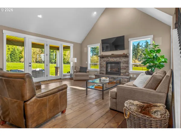 a living room with fireplace furniture and a flat screen tv