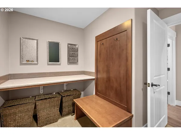 a view of an entryway with wooden floor