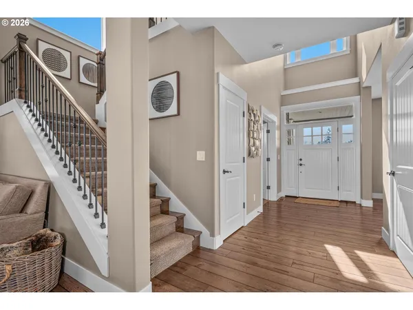 a view of hallway with livingroom and furniture